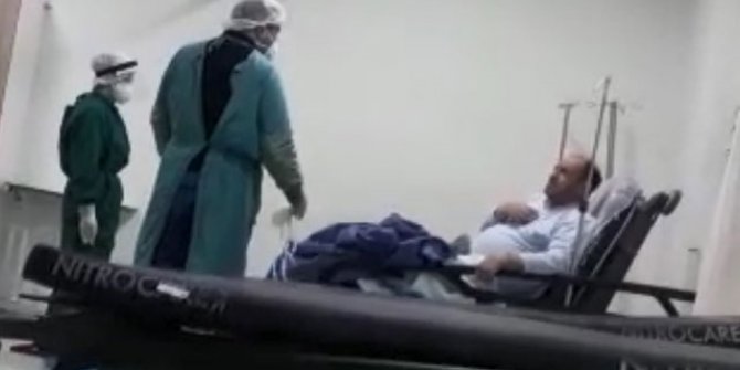 Koronavirüs şüphesi olan hasta, maske takmamak için direndi