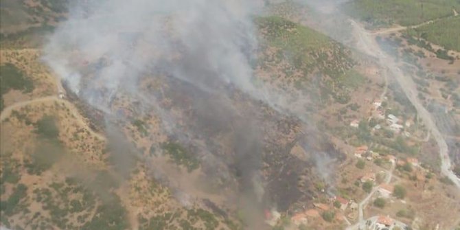 Muğla'da yerleşim yerlerini tehdit eden orman yangını kontrol altına alınmaya çalışılıyor