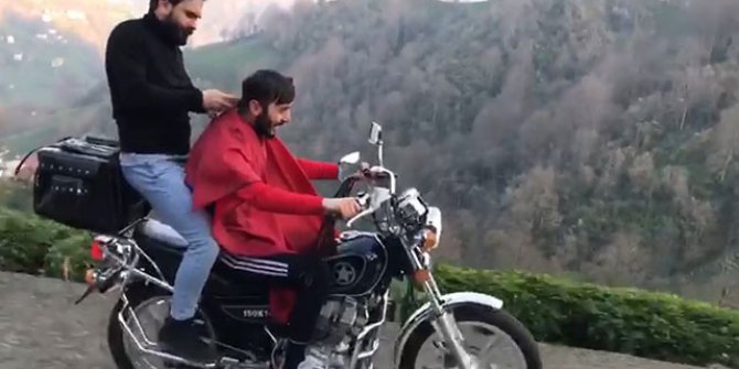 Hareket halindeki motosiklette sürücüyü tıraş etti