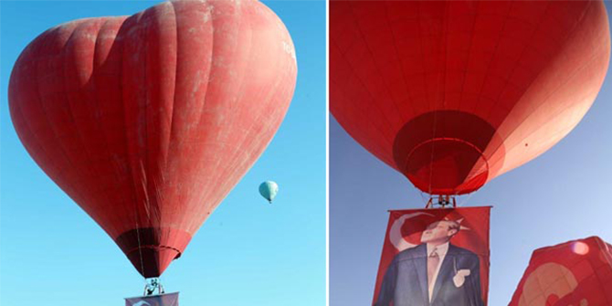 Kapadokya'da sıcak hava balonları Atatürk posteri ve bayrakla havalandı