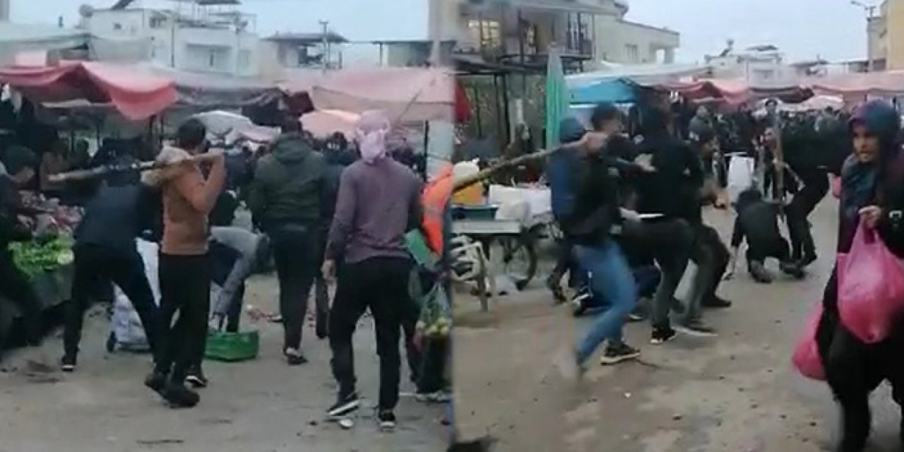 Pazarda iki grup sopalarla birbirine girdi