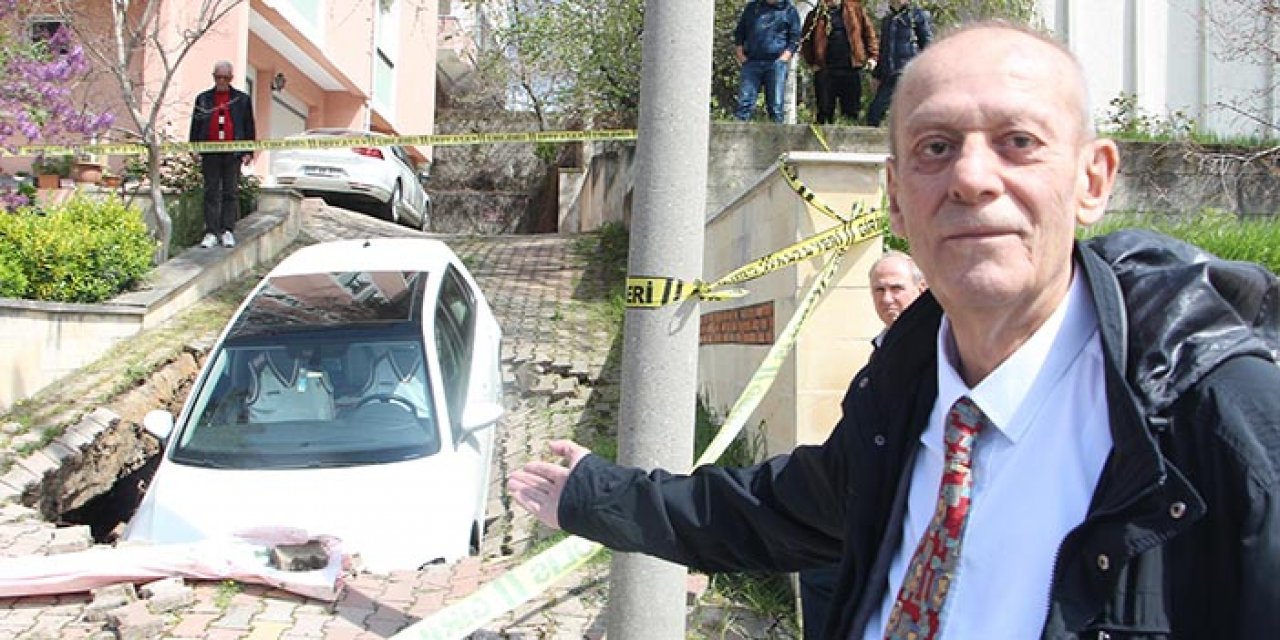 Aracıyla çöken yolun çukuruna düştü