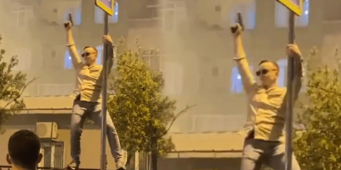 Asker uğurlamasında direğe çıkıp dans etti, havaya ateş açtı