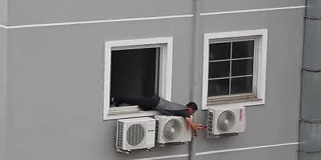 Klima ustası canını hiçe saydı! Yedinci kattan sarkarak klima taktı