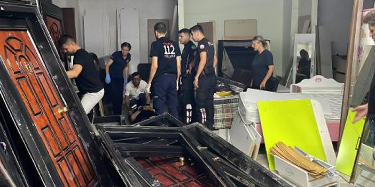 Üzerine çelik kapı düşen kadın yaralandı