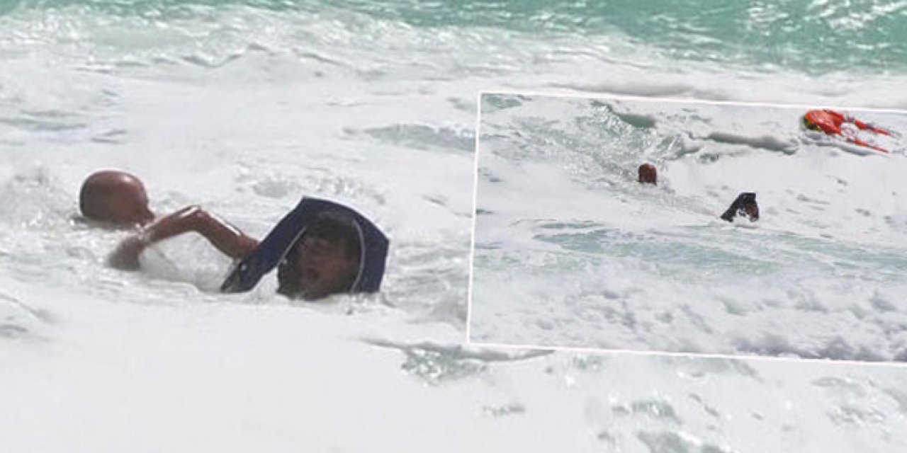 Dalgalara rağmen denize girdi: İnsansız robot kurtardı