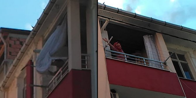Evini ateşe verip, eşyalarını balkondan attı